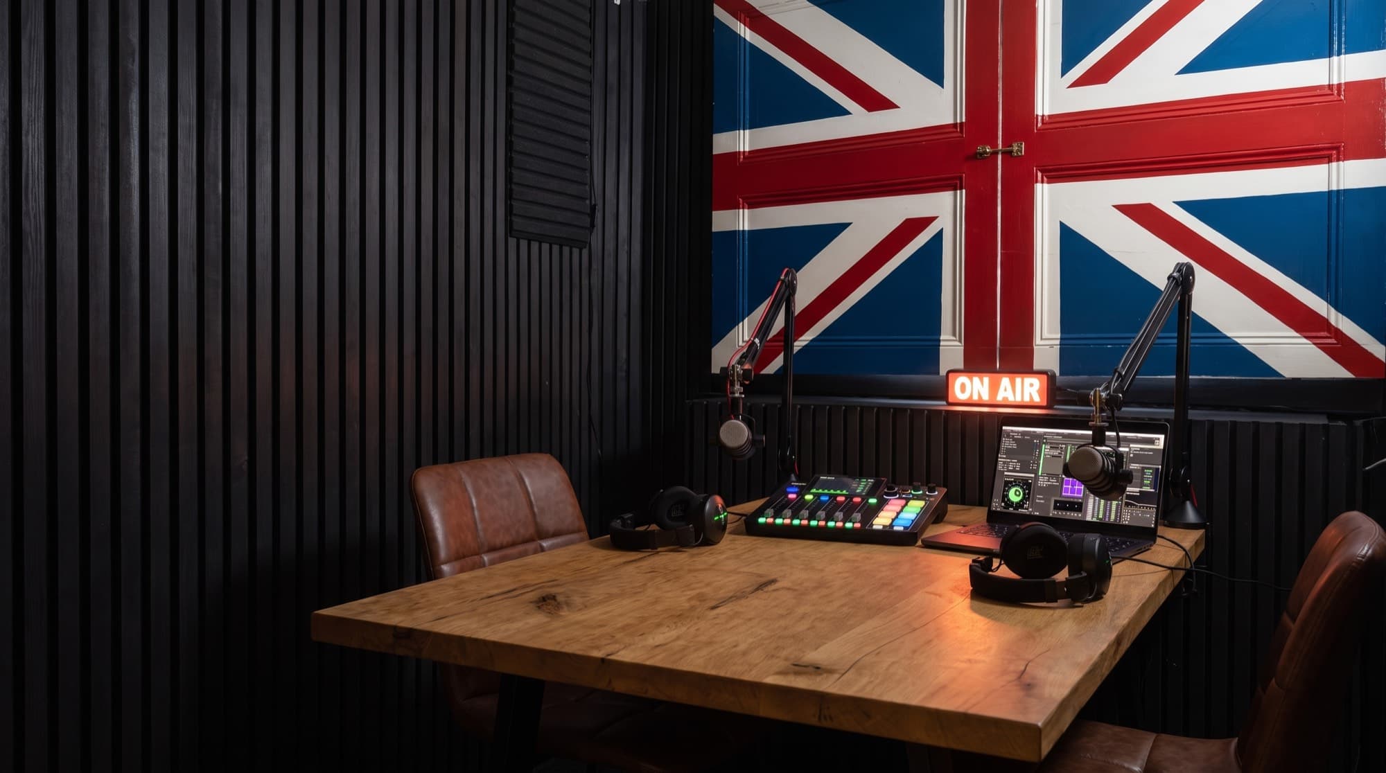 The Signal Room, with the Union Jack doors, slat walls, and the podcast desk